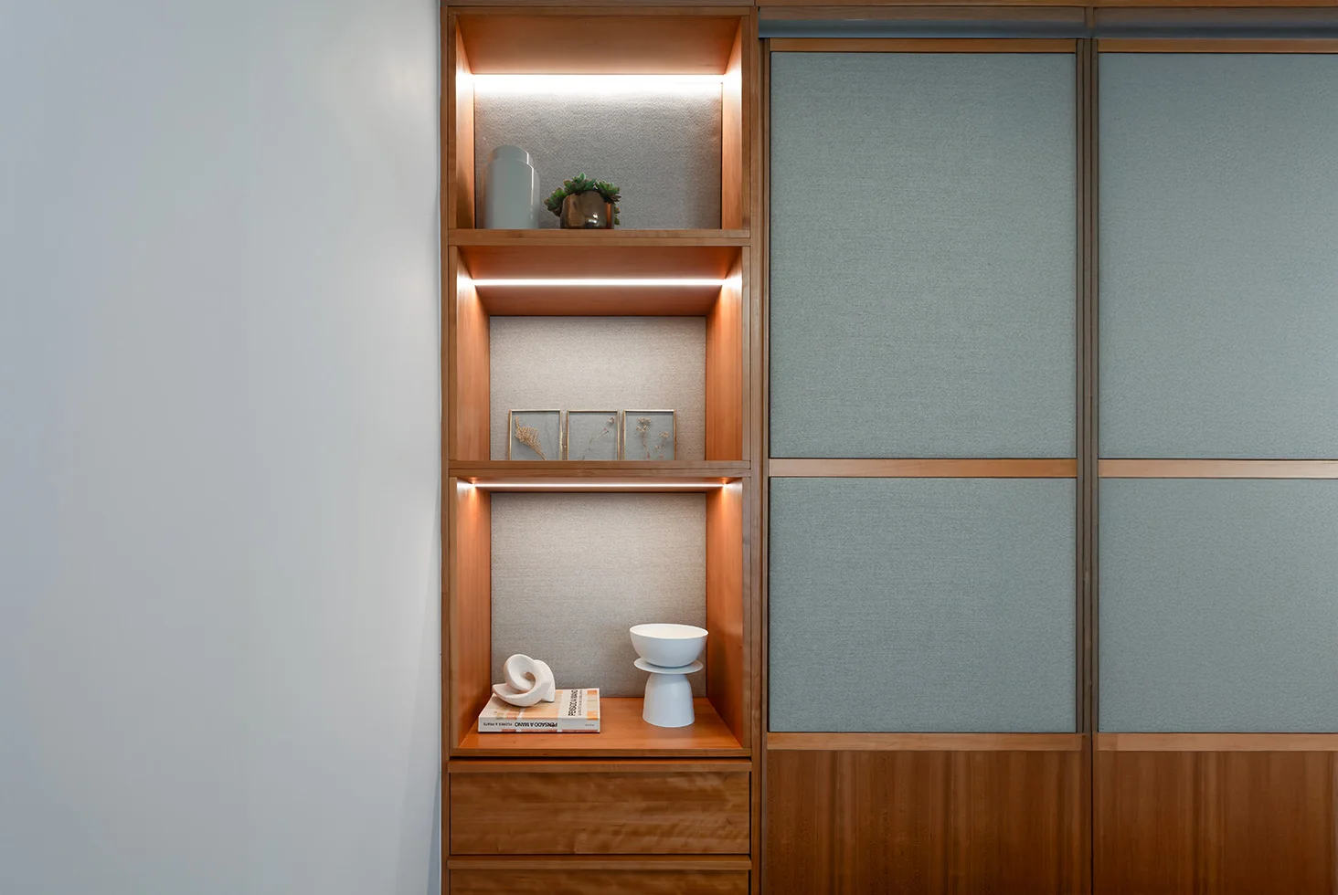 Arenales Apartment residential shelf detail with lighting and decor.