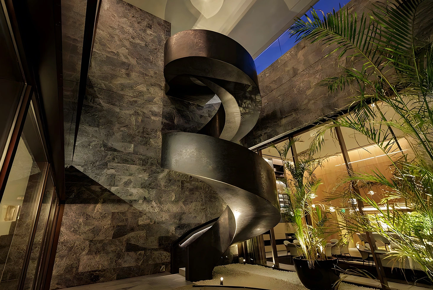 Martín Coronado multi-residential spiral staircase interior.